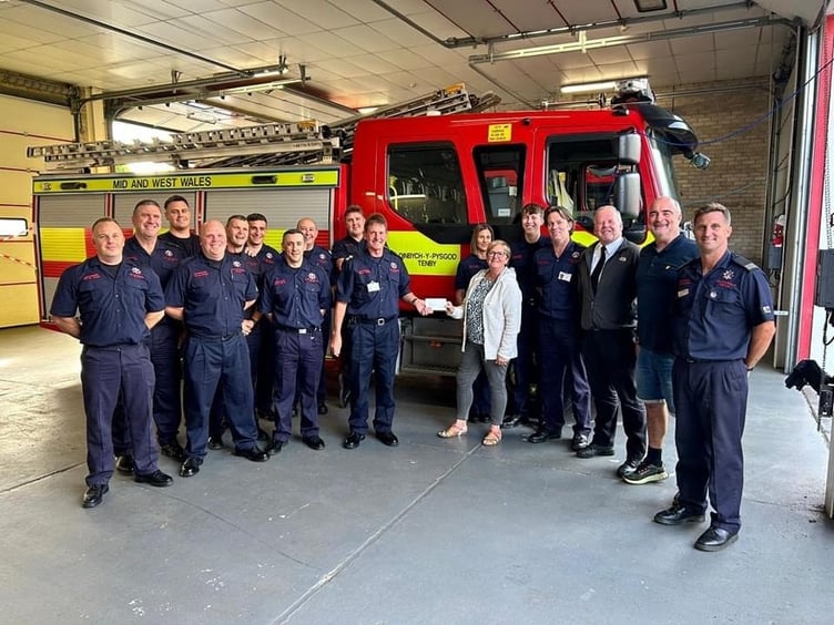 Pictured along with Tenby Station Firefighters are Saundersfoot NYDS Committee secretary Lynn Knibbs, Treasurer Anthony Mattick and Chairman Chris Williams.