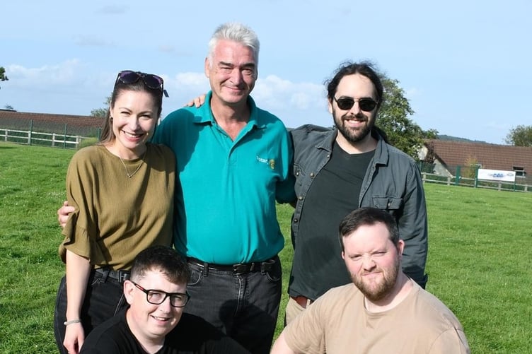 President of Narberth and Whitland Rotary Dr Paul Crawford with local band Sleeping Dogs