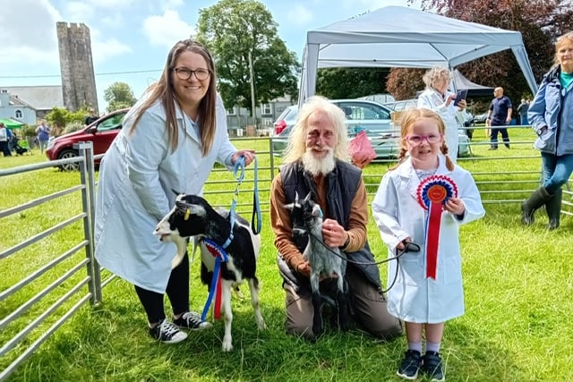 With the judge at Lamphey Show are Mari Arthur with her champion female kid, Nelle and Jac Arthur’s reserve champion female goat, Bounty.