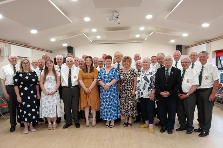 Choristers, soloists, musical teams and Choir President Clive Collins at Lamphey Village Hall.