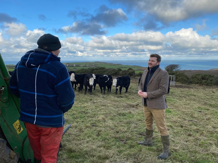 Samuel Kurtz speaks to farmer