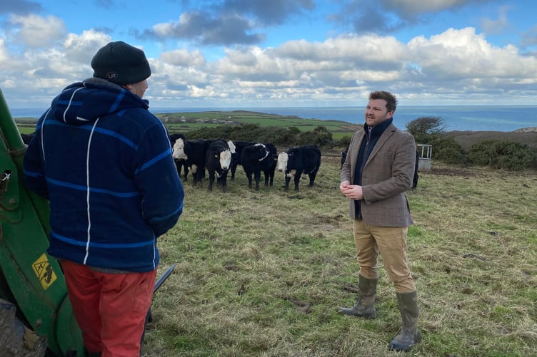 Samuel Kurtz speaks to farmer