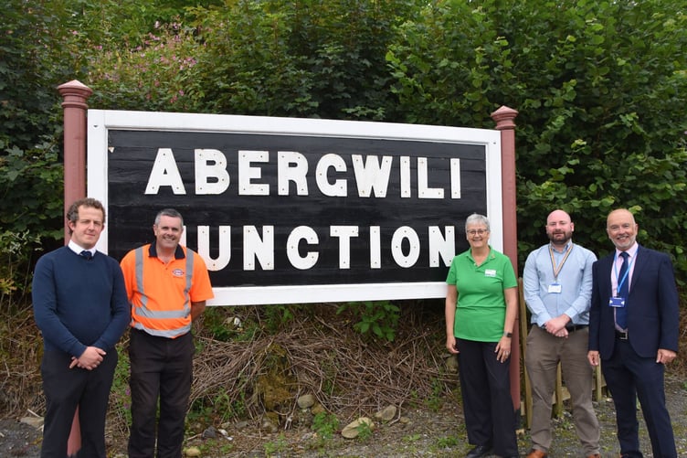 From left - representatives of Gwili Railway Company James Buckley and Simon Jones with Janet MacKrell, a Macmillan Urology Cancer Support Worker at Glangwili Hospital who has booked her place in the new car park. Next to Janet are Alex Howells Transport and Travel Coordinator and Ceri Rees, Transport Development Manager of Hywel Dda’s Transport team.