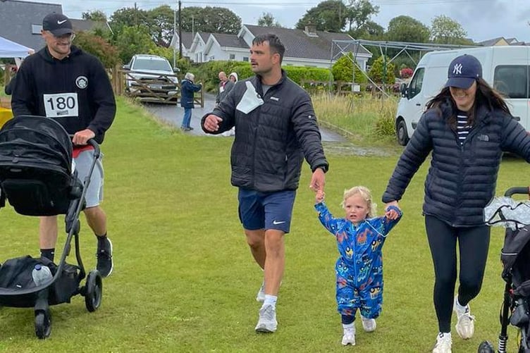 Dan Storer taking part in Dash for Ash, Kilgetty, with his daughter and Jesse Proctor having a second wind.