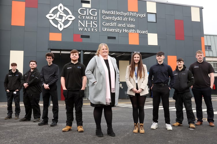 Emma Bendle (centre), apprenticeship and widening access co-ordinator, with staff and apprentices at Cardiff and Vale University Health Board.