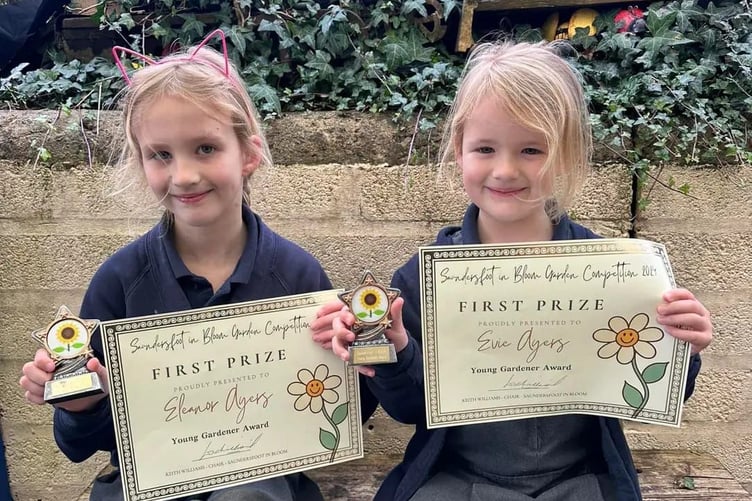 Pictured are Eleanor Ayers (6) and Evie Ayers (4) being awarded their Saundersfoot in Bloom Young Gardeners awards at Templeton Primary School.