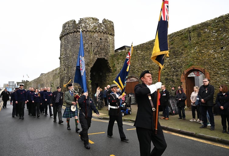 The Remembrance Sunday parade assembled outside St Mary’s Church to depart for the War Memorial alongside Tenby's historic town walls.
