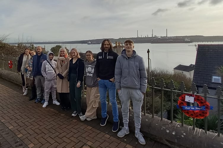 Young people have created a Poppy Walk along Hamilton Terrace in Milford Haven. Alfie, Kaden, Lily, Megan and Jenna are pictured with staff from Pembrokeshire Youth Service and Futureworks.