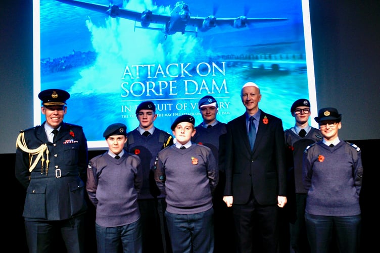 Air Commodore Rob Woods, Air Officer Wales, and Andrew Panton with staff and cadet members of No 948 (Haverfordwest) Squadron, Air Cadets, following the film screening at the Torch Theatre. Photo: Philip Clarke