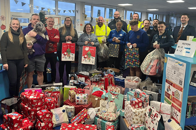 Gifts for children being presented to Pembrokeshire Action to Combat Hardship (PATCH) as a result of Haven School’s Tags on the Tree project