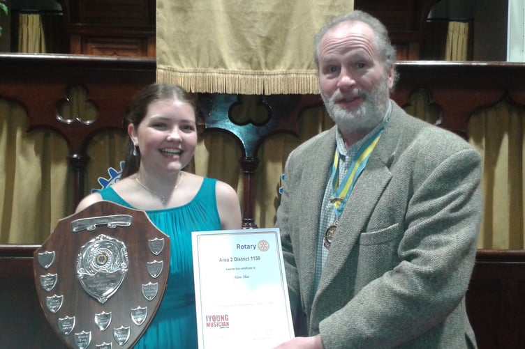 Harpist Alaw Elisa receiving her award at the South West Wales Finals of the Rotary Young Musician of the Year, held in Bethesda Chapel, Narberth.