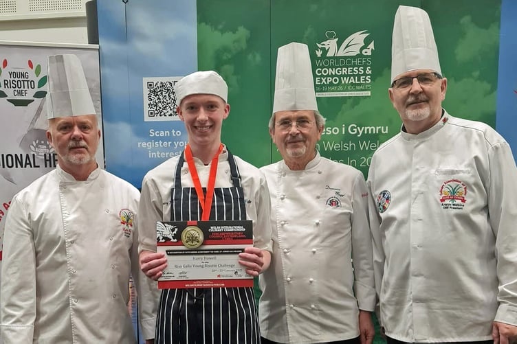 Carmarthenshire’s Harry Howell receives his award from Colin Gray and Arwyn Watkins, OBE from the Culinary Association of Wales and Domenico Maggi.