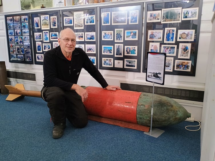 Diver Steve Jones with the Zalinski gun projectile at Pembroke Dock Heritage Centre