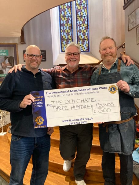Ian Rees (right) receiving the donation from Tenby & District Lions
