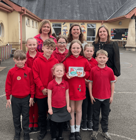 Pembrokeshire Local Authority's Catrin Phillips visited Narberth Community Primary School on Wednesday to present an award for achieving silver status in the Siarter Iaith. She is pictured here with Headteacher Mrs Kate Moore, Criw Cymraeg leaders Chloe Ormond and Meinir Lloyd and pupils in the Welsh and English streams.
