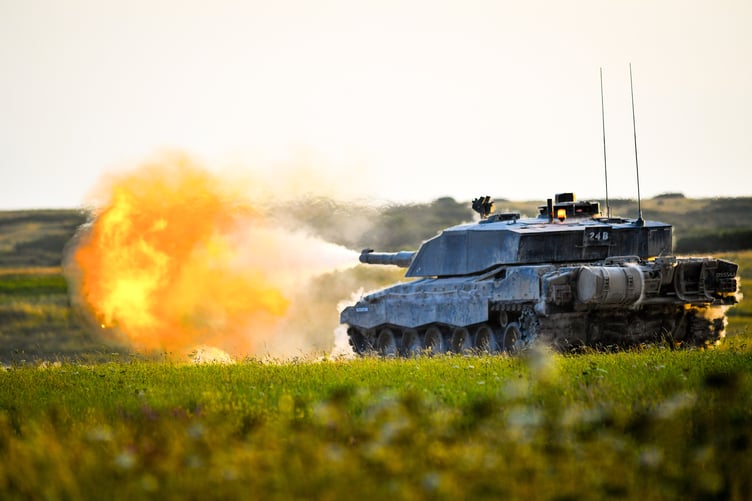 Challenger 2 Main Battle Tank fires towards targets at its front on the range while the dust vibrates off of the armour.
The Royal Tank Regiment (RTR) have recently been conducting their Annual Crew Tests and their Annual Troop Assessment Training on Castlemartin Ranges in South West Wales.
Based in Tidworth The Royal Tank Regiment are equipped with the Challenger 2 Main Battle Tank and supported by the Scimitar armoured reconnaissance vehicles.
The Annual Troop Assessment sees the troops of 4 Tanks begin firing first from static positions before they progress to the more demanding challenge of identifying and engaging distant targets while on the move.
Over the duration of the training the 17 tanks in Badger Squadron RTR, who are pictured, will Fire approximately 50,000 7.62mm rounds out of the Coaxial Machine Gun and 3,500 120mm rounds out of the Main Armament
With their skills and drills now thoroughly assessed the tank crews are now ready and able to deploy on operations abroad and conduct live firing on exercises in the UK.