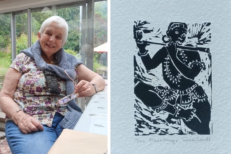 Oriel Q member Susan Sands, alongside one of her linocut artworks: Flute Player