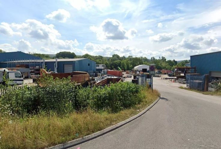 Entrance to the TRJ Ltd yard off Foundry Road, Ammanford, where a new retail park has planning consent