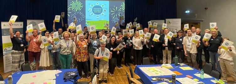 Guests with their copies of the Volunteering Strategy