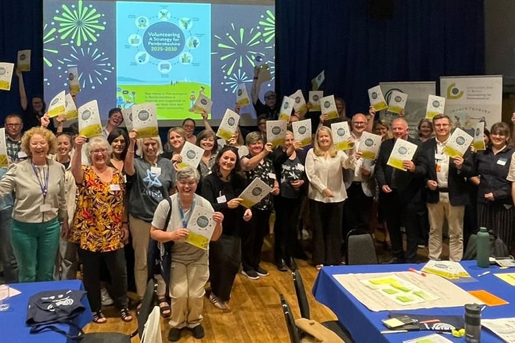 Guests with their copies of the Volunteering Strategy