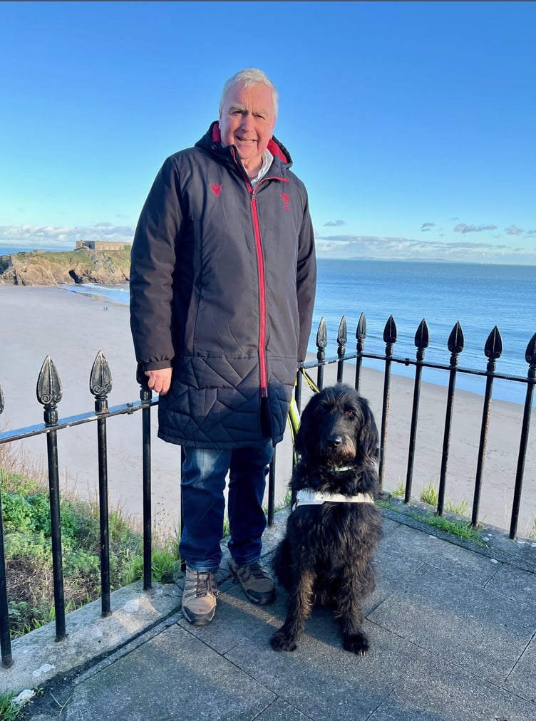 Adge John and guide dog Skip