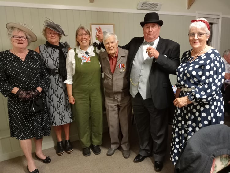 Joining ‘Mr and Mrs Churchill’ – Richard and Carol Johns – at The Rhos VJ-Day party were, left to right: Pam Shepherd, Christine Akers, Sue Jones and wartime Veteran Duncan Hilling.