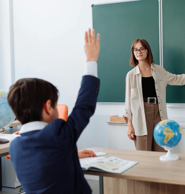 School pupil and teacher in classroom