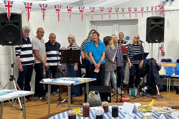 Manorbier’s Cockles and Mussels Choir taking part in the successful inaugural Village Show at the Giraldus Centre
