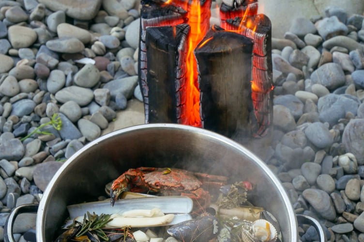 Craig Evans lit a ‘Solva stove’ - a Swedish-style log fire - to cook the haul foraged by Coleg Ceredigion students on the Saundersfoot coast