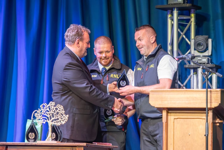 Rob James and Chris ‘Yobbler’ Thomas receiving their Blue Light Awards from Cllr Laurence Blackhall