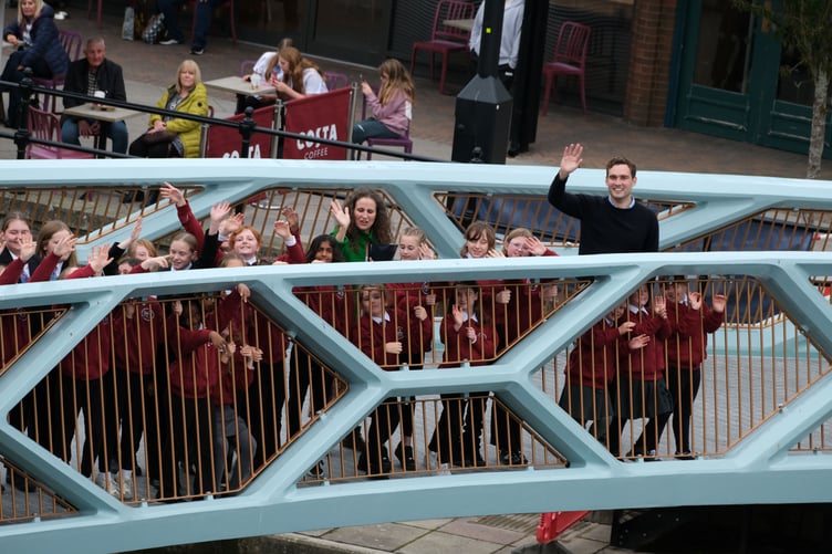 A wave from Henry Tufnell and the Prendergast choristers on the new bridge, Haverfordwest
