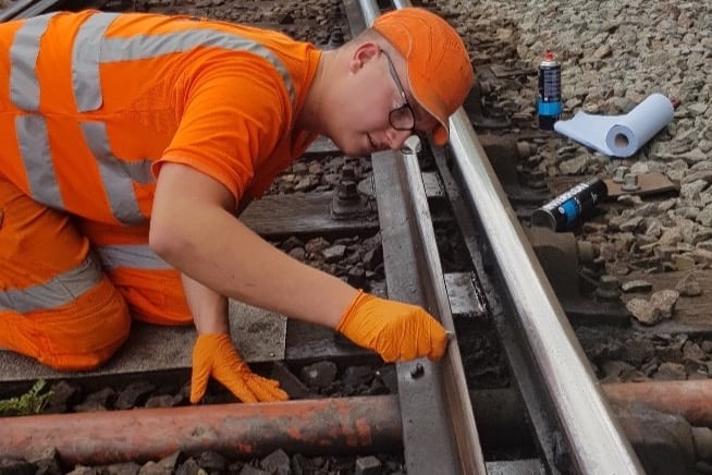 Apprentice Charles French fault finding during railway closure