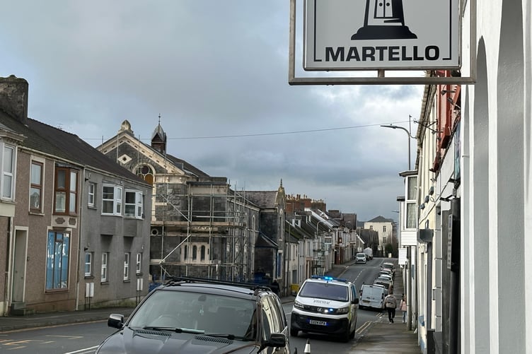 Police vehicle in Bush Street on February 13, a section of which was closed during the morning as police undertook arrests.