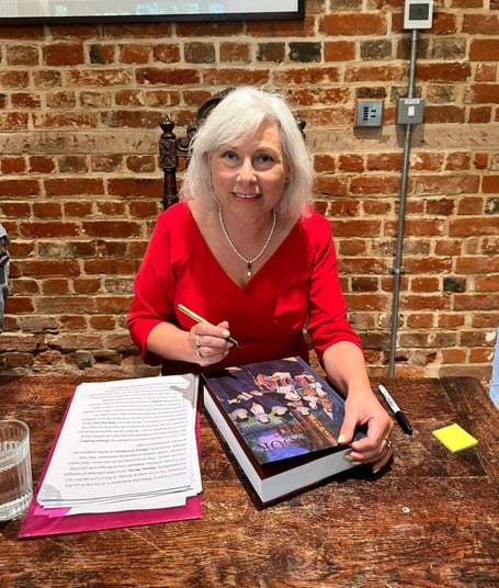 Melita Thomas signing her book 1000 Tudor People