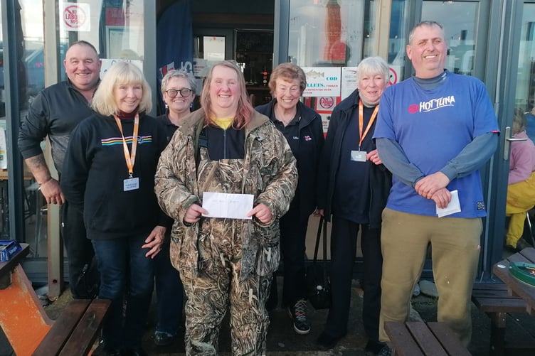 The winner Alison George (front centre) with a couple of the pairs winners Andrew Jamieson and Ed Pritchard (on each end) with Jennie McIntosh and three of her members of the Saundersfoot branch of the RNLI