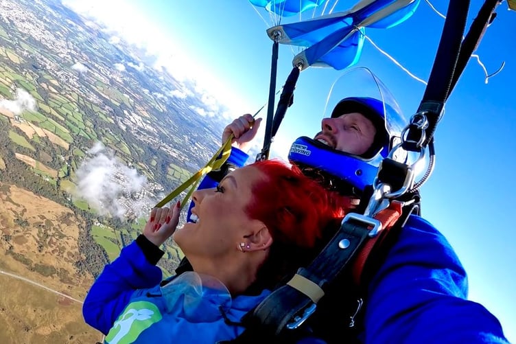 Philippa Langley doing a tandem skydive for Tŷ Hafan Children's Hospice over Swansea Airfield last year (2025)