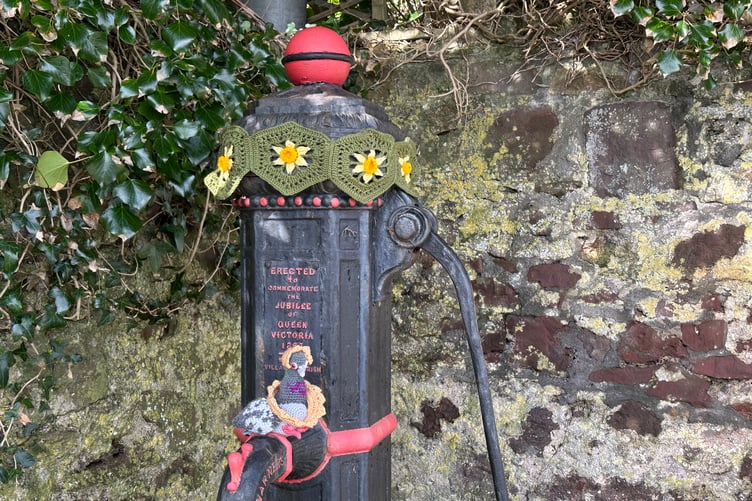 Daffodils adorn the village pump at Penally, Pembrokeshire