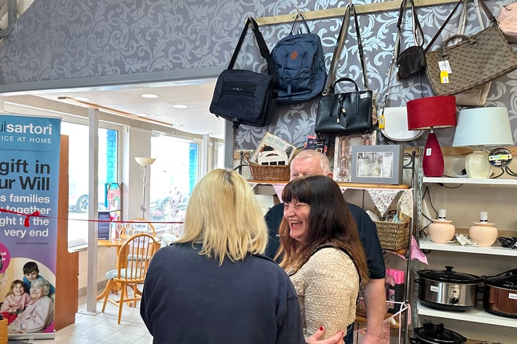 Paul Sartori Hospice at Home stocks a wide range of items in its newly expanded Pembroke Dock store. Mayor Michele Wiggins sharing a joke at the Grand Opening ceremony