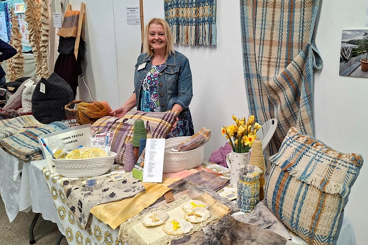 Emma Allin-Thomas with some of her woven, naturally dyed, Welsh yarn products