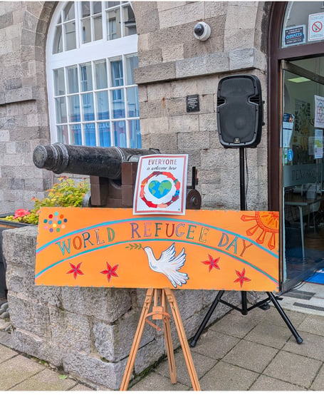 World Refugee Day at Pembroke Town Hall. Sign painted by Charlotte Cortazzi