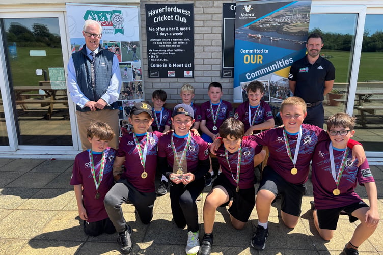 Pembrokeshire Champions Saundersfoot CP School Boys’ Cricket Team sporting their new shirts sponsored by Caldey Construction and New Hedges Saundersfoot Football Club